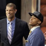 Michigan's Trey Burke, right, is interviewed by Miami Heat's Shane Battier after being selected by the Sacramento Kings in the first round of the NBA basketball draft, Thursday, June 27, 2013, in New York. (AP Photo/Kathy Willens)