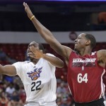 Phoenix Suns' Dionte Christmas (22) shoots against Miami Heat's James Nunnally in the second quarter of an NBA Summer League basketball game, Sunday, July 21, 2013, in Las Vegas. (AP Photo/Julie Jacobson)