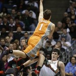 Phoenix Suns' Goran Dragic (1) is fouled by Milwaukee Bucks' Ersan Ilyasova, bottom, during the second half of an NBA basketball game Tuesday, Jan. 8, 2013, in Milwaukee. (AP Photo/Jeffrey Phelps)