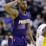 
Phoenix Suns forward Markieff Morris signals after hitting a 3-point bucket against the Indiana Pacers late in the second of an NBA basketball game in Indianapolis, Thursday, Jan. 30, 2014. The Suns defeated the Pacers 102-94. (AP Photo)