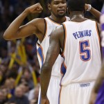 Oklahoma City Thunder forward Kevin Durant, left, bumps chests with Kendrick Perkins (5) following a basket by Perkins in the third quarter of an NBA basketball game against the Phoenix Suns in Oklahoma City, Friday, Feb. 8, 2013. Oklahoma City won 127-96. (AP Photo/Sue Ogrocki)