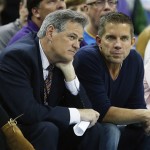 Mickey Loomis, executive vice president/general manager of the New Orleans Saints, talks with Saints head coach Sean Payton, right, in the first half of an NBA basketball game between the New Orleans Hornets and the Phoenix Suns in New Orleans, Wednesday, Feb. 6, 2013. (AP Photo/Bill Haber)