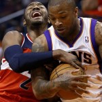 Washington Wizards' John Wall (2) loses the ball to Phoenix Suns' P.J. Tucker during the first half of an NBA basketball game on Wednesday, March 20, 2013, in Phoenix. (AP Photo/Matt York)