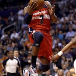 Washington Wizards' John Wall scores against the Phoenix Suns during the first half of an NBA basketball game on Wednesday, March 20, 2013, in Phoenix. (AP Photo/Matt York)
