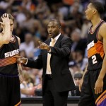 Phoenix Suns head coach Lindsey Hunter, center, talks with Goran Dragic, of Slovenia, and Wesley Johnson (2) during the second half of an NBA basketball game against the Brooklyn Nets, Sunday, March 24, 2013, in Phoenix. The Nets won 102-100.(AP Photo/Matt York)
