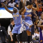 Denver Nuggets' Ty Lawson (3) and JaVale McGee celebrate against the Phoenix Suns during the second half of an NBA basketball game, Monday, March 11, 2013, in Phoenix. (AP Photo/Matt York)