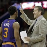 Phoenix Suns head coach Jeff Hornacek talks to point guard Ish Smith (3) in the fourth quarter of an NBA basketball game against the Cleveland Cavaliers, Sunday, Jan. 26, 2014, in Cleveland. The Suns won 99-90. (AP Photo/Mark Duncan)