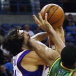 Phoenix Suns power forward Luis Scola, left, and New Orleans Hornets power forward Anthony Davis (23) battle for a loose ball in the first half of an NBA basketball game in New Orleans, Wednesday, Feb. 6, 2013. (AP Photo/Bill Haber)