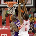 Houston Rockets forward Terrence Jones (6) is fouled by Phoenix Suns center Jermaine O'Neal (20) during the first half of an NBA basketball game Tuesday, April 9, 2013, in Houston. (AP Photo/Bob Levey)