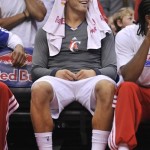Los Angeles Clippers forward Blake Griffin reacts as he looks at a video screen while he sits on the bench in the second half of an NBA basketball game against the Phoenix Suns in in Los Angeles on Wednesday, April 3, 2013. (AP Photo/Richard Hartog)