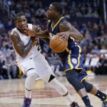 Indiana Pacers guard Donald Sloan (15) drives against Phoenix Suns guard Eric Bledsoe (2) during the first half of an NBA basketball game in Phoenix Tuesday, Dec. 2, 2014 . (AP Photo/Matt York)