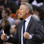 Philadelphia 76ers coach Brett Brown shouts instructions to his players during the first half of an NBA basketball game against the Phoenix Suns on Friday, Jan. 2, 2015, in Phoenix. (AP Photo/Ross D. Franklin)
