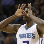 Charlotte Hornets' Marvin Williams gestures after making a 3-point basket against the Phoenix Suns during the first half of an NBA basketball game in Charlotte, N.C., Wednesday, Dec. 17, 2014. (AP Photo/Chuck Burton)