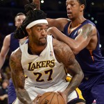  Los Angeles Lakers forward Jordan Hill (27) battles Phoenix Suns forward Channing Frye, back right, in the first half of an NBA basketball game, Sunday, March 30, 2014, in Los Angeles.(AP Photo/Gus Ruelas)