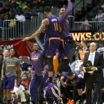 
Phoenix Suns forward Markieff Morris (11) and Phoenix Suns forward Marcus Morris, right, celebrate as basket in the second half of an NBA basketball game Monday, March 24, 2014, in Atlanta. Phoenix defeated Atlanta 102-95. (AP Photo/Jason Getz)