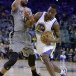 Golden State Warriors' Harrison Barnes, right, drives the ball against Phoenix Suns' Marcus Morris during the second half of an NBA basketball game Thursday, April 2, 2015, in Oakland, Calif. (AP Photo/Ben Margot)