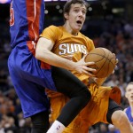 Phoenix Suns' Goran Dragic, right, of Slovenia, drives past Detroit Pistons' Kentavious Caldwell-Pope, left, during the second half of an NBA basketball game Friday, Dec. 12, 2014, in Phoenix. The Pistons defeated the Suns 105-103. (AP Photo/Ross D. Franklin)