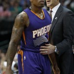 Phoenix Suns Jeff Hornacek talks with Eric Bledsoe (2) as he walks off the court against the Dallas Mavericks in the first half of the NBA basketball game in Dallas on Wednesday, April 8, 2015. (AP Photo/Brad Loper)