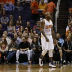 Phoenix Suns forward P.J. Tucker walks away after a foul during the second half of an NBA basketball game against the Memphis Grizzlies, Wednesday, Nov. 5, 2014, in Phoenix. The Grizzlies won 102-91. (AP Photo/Matt York)