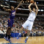 Dallas Mavericks forward Dirk Nowitzki (41) shoots as Phoenix Suns guard Archie Goodwin defends during the second half of an NBA basketball game in Dallas on Wednesday, April 8, 2015. Dallas won 107-104. (AP Photo/Brad Loper)