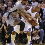 Phoenix Suns' Marcus Morris, left, scrambles for the ball with Golden State Warriors' Leandro Barbosa during the first half of an NBA basketball game Thursday, April 2, 2015, in Oakland, Calif. (AP Photo/Ben Margot)