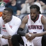 
Atlanta Hawks guard Shelvin Mack (8, left) and Atlanta Hawks forward DeMarre Carroll (5) sit dejected on the bench in the closing minutes of their loss to the Phoenix Suns in an NBA basketball game Monday, March 24, 2014, in Atlanta. Phoenix defeated Atlanta 102-95. (AP Photo/Jason Getz)