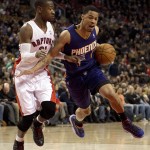  Phoenix Suns guard Gerald Green, right, drives around Toronto Raptors guard Terrence Ross during the first half of an NBA basketball game in Toronto on Sunday, March 16, 2014. (AP Photo/The Canadian Press, Frank Gunn)