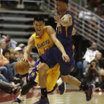 Los Angeles Lakers' Jeremy Lin, left, is defended by Phoenix Suns' Gerald Green during the first half of a preseason NBA basketball game on Tuesday, Oct. 21, 2014, in Anaheim, Calif. (AP Photo/Jae C. Hong)
