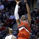Portland Trail Blazers forward LaMarcus Aldridge shoots over Phoenix Suns forward Markieff Morris during the second half of an NBA basketball game in Portland, Ore., Thursday, Feb. 5, 2015. Aldridge scored 19 points and pulled in 13 rebounds as the Trail Blazers won 108-87. (AP Photo/Don Ryan)