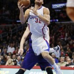 Los Angeles Clippers' Blake Griffin goes to the basket as he is fouled by Phoenix Suns' Alex Len, rear, during the second half of an NBA basketball game Saturday, Nov. 15, 2014, in Los Angeles. The Clippers won 120-107. (AP Photo/Danny Moloshok)