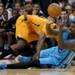 Charlotte Hornets forward Marvin Williams passes under pressure from Phoenix Suns forward Anthony Tolliver during the first half of an NBA basketball game, Friday, Nov. 14, 2014, in Phoenix. (AP Photo/Matt York)