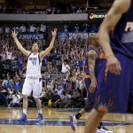 Dallas Mavericks forward Dirk Nowitzki reacts after hitting a 3-pointer against the Phoenix Suns late in the second half of the NBA basketball game in Dallas on Wednesday, April 8, 2015. Dallas won 107-104. (AP Photo/Brad Loper)