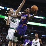  Phoenix Suns guard Eric Bledsoe (2) drives to the basket against Boston Celtics center Tyler Zeller (44) during the second half of an NBA basketball game in Boston, Monday, Nov. 17, 2014. The Suns defeated the Celtics 118-114. (AP Photo/Charles Krupa)