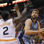  Memphis Grizzlies' Marc Gasol, of Spain, looks to shoot as Phoenix Suns' Eric Bledsoe (2) defends during the first half of an NBA basketball game, Monday, April 14, 2014, in Phoenix. (AP Photo/Matt York)