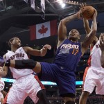  Phoenix Suns guard P.J.Tucker (17) rebounds against Toronto Raptors guards DeMar DeRozan, left, and Kyle Lowry during the first half of an NBA basketball game in Toronto on Sunday, March 16, 2014. (AP Photo/The Canadian Press, Frank Gunn)