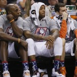 Phoenix Suns' Anthony Tolliver, P.J. Tucker and Goran Dragic, of Slovenia, from left, watch from the bench during the second half of an NBA basketball game against the Memphis Grizzlies, Wednesday, Nov. 5, 2014, in Phoenix. The Grizzlies won 102-91. (AP Photo/Matt York)