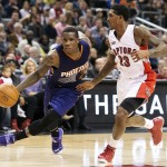 Phoenix Suns' Eric Bledsoe, left, drives the ball past Toronto Raptors' Lou Williams during the second half of an NBA basketball game in Toronto on Monday, Nov. 24, 2014. (AP Photo/The Canadian Press, Darren Calabrese)