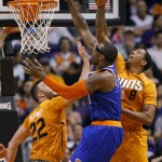New York Knicks' Amare Stoudemire misses a dunk as Phoenix Suns' Miles Plumlee (22) and Channing Frye (8) defend during the second half of an NBA basketball game, Friday, March 28, 2014, in Phoenix. The Suns won 112-88. (AP Photo/Matt York)