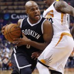Brooklyn Nets' Jarrett Jack, left, collides with Phoenix Suns' Isaiah Thomas during the first half of an NBA basketball game Wednesday, Nov. 12, 2014, in Phoenix. (AP Photo/Ross D. Franklin)