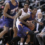 Phoenix Suns guard Eric Bledsoe, right, looks to an official for the call after a play against Atlanta Hawks guard Louis Williams, center, in the second half of an NBA basketball game Monday, March 24, 2014, in Atlanta. Also pictured is Phoenix Suns forward Channing Frye. Phoenix defeated Atlanta 102-95. (AP Photo/Jason Getz)