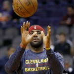 Cleveland Cavaliers' LeBron James warms up prior to the Cavaliers' NBA basketball game against the Phoenix Suns, Tuesday, Jan. 13, 2015, in Phoenix. (AP Photo/Matt York)