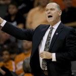 Sacramento Kings coach Michael Malone calls a play during the first half of an NBA basketball game against the Phoenix Suns, Friday, Nov. 7, 2014, in Phoenix. The Kings won 1114-112 in double overtime. (AP Photo/Matt York)