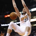 Phoenix Suns' Miles Plumlee dunks against the Brooklyn Nets during the second half of an NBA basketball game Wednesday, Nov. 12, 2014, in Phoenix. The Suns defeated the Nets 112-104. (AP Photo/Ross D. Franklin)