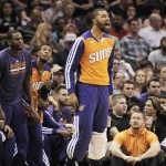 The Phoenix Suns bench celebrates a basket during the first half of an NBA basketball game against the San Antonio Spurs on Friday, April 11, 2014, in San Antonio. (AP Photo/Darren Abate)
