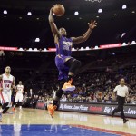 Phoenix Suns guard Eric Bledsoe goes for a dunk during the second half of an NBA basketball game against the Detroit Pistons in Auburn Hills, Mich., Wednesday, Nov. 19, 2014. Bledsoe finished the game with 18 points in the Suns' 88-86 win. (AP Photo/Carlos Osorio)
