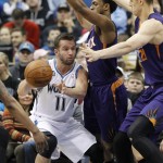 Minnesota Timberwolves guard J.J. Barea (11) looks to pass under pressure from Phoenix Suns guard Ish Smith, center, and center Alex Len, right, of Ukraine, during the second quarter of an NBA basketball game in Minneapolis, Sunday, March 23, 2014. The Suns won 127-120. (AP Photo/Ann Heisenfelt)