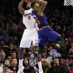 Los Angeles Clippers' DeAndre Jordan, left, grabs the ball away from Phoenix Suns' Marcus Morris, right, as he goes to the hoop while a jump ball is called during the first half of an NBA basketball game Saturday, Nov. 15, 2014, in Los Angeles. (AP Photo/Danny Moloshok)