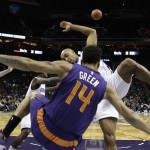 Phoenix Suns' Gerald Green, front, falls after being fouled by Charlotte Hornets' Gerald Henderson, back right, during the first half of an NBA basketball game in Charlotte, N.C., Wednesday, Dec. 17, 2014. (AP Photo/Chuck Burton)