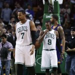  Boston Celtics forward Jared Sullinger (7) and guard Rajon Rondo (9) walk up court at the final buzzer in a loss to the Phoenix Suns in an NBA basketball game in Boston, Monday, Nov. 17, 2014. The Suns defeated the Celtics 118-114. (AP Photo/Charles Krupa)