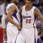 Los Angeles Clippers forward Danny Granger, left, body bumps to congratulate forward Matt Barnes (22) on making a three-point shot to end the third quarter in an NBA basketball game against Phoenix Suns Monday, March 10, 2014, in Los Angeles. Clippers won 112-105. (AP Photo/Alex Gallardo)